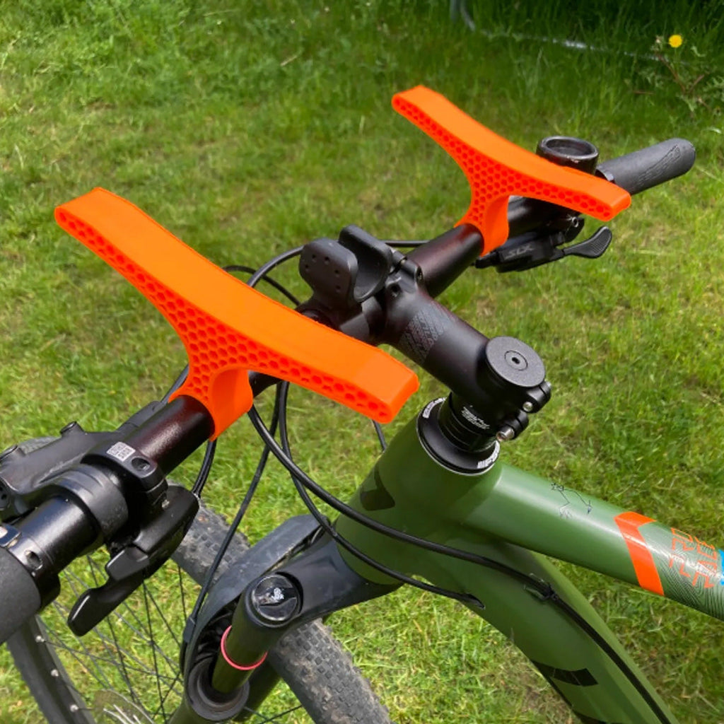Pair of handlebar repair cradles supporting an upside-down mountain bike, view 2