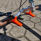 Pair of handlebar repair cradles supporting an upside-down mountain bike, view 4
