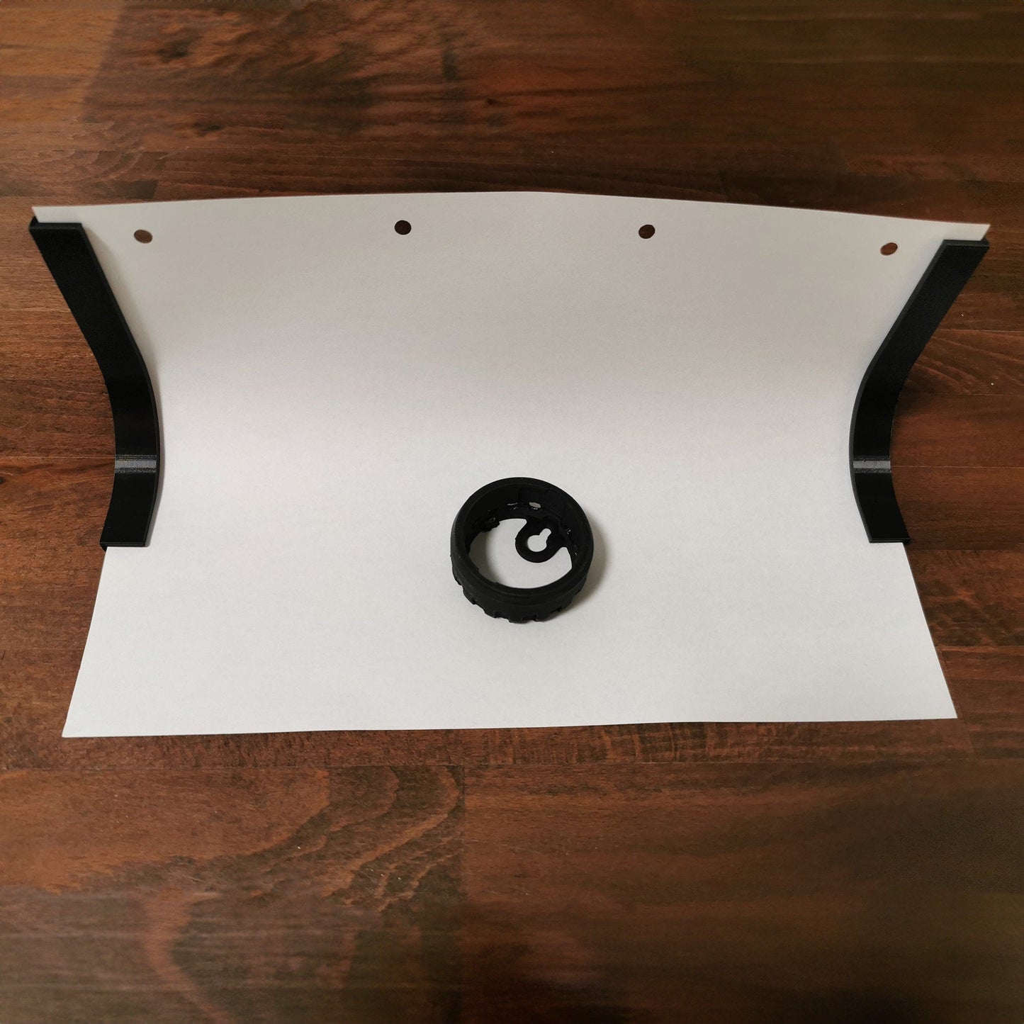 a piece of paper with a black circle on it