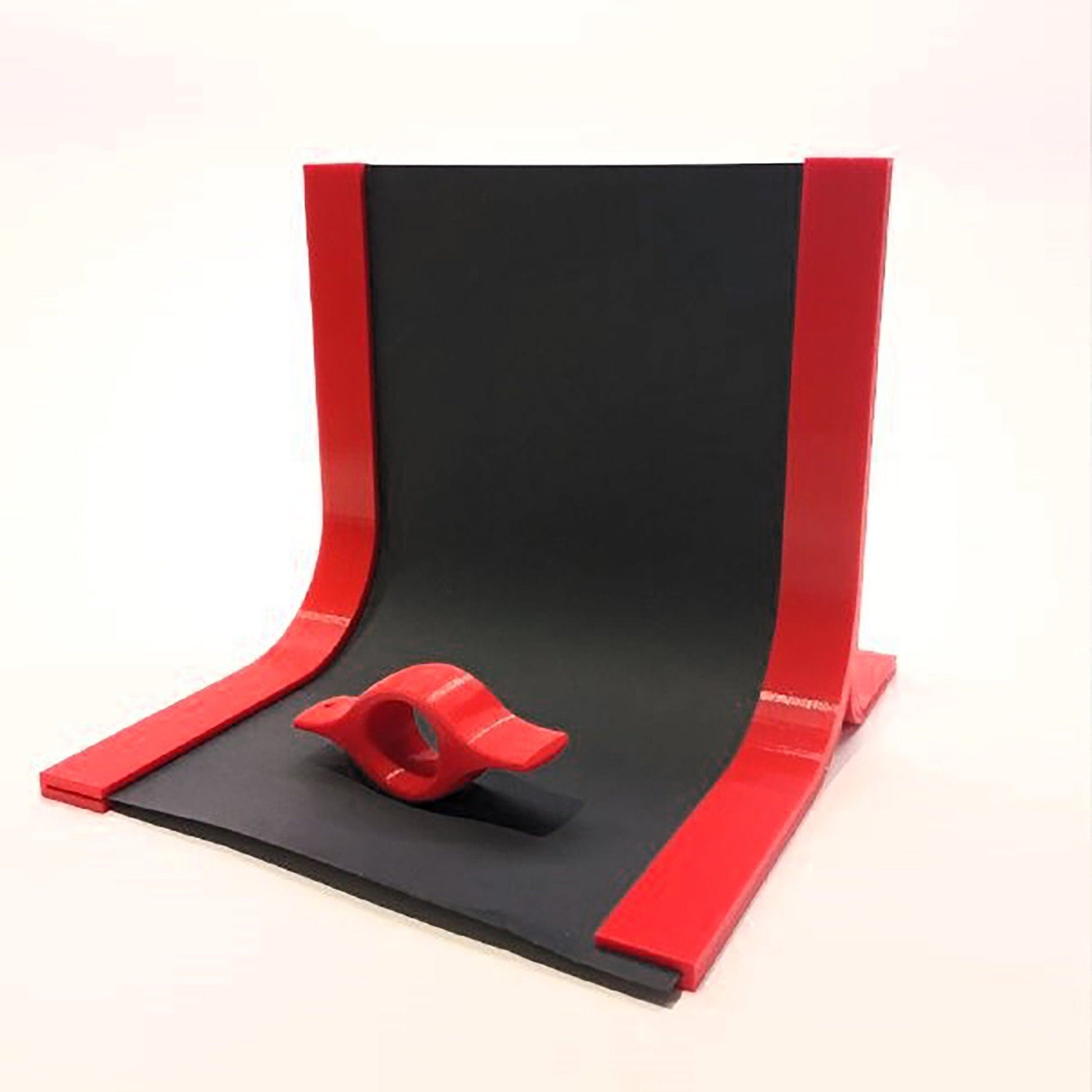 a red and black object on a white background