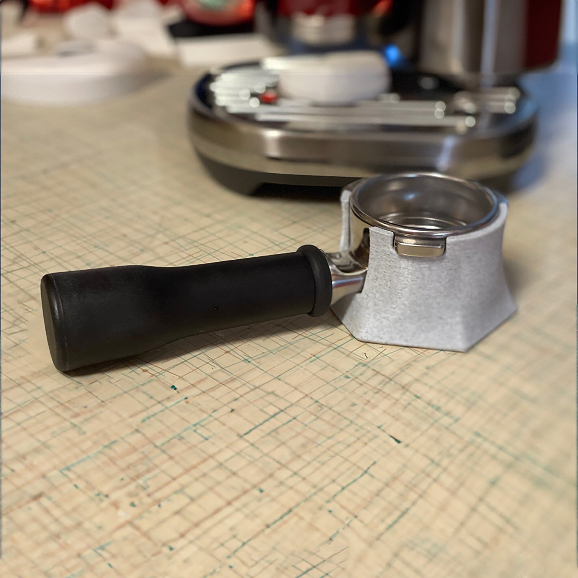 a kitchen counter with a knife and a can opener on it