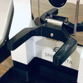 Fork-shaped portafilter holder on the front of a Eureka Mignon Specialita grinder