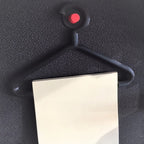Mini coat hanger sticky note holder pinned to a cork board, view 4