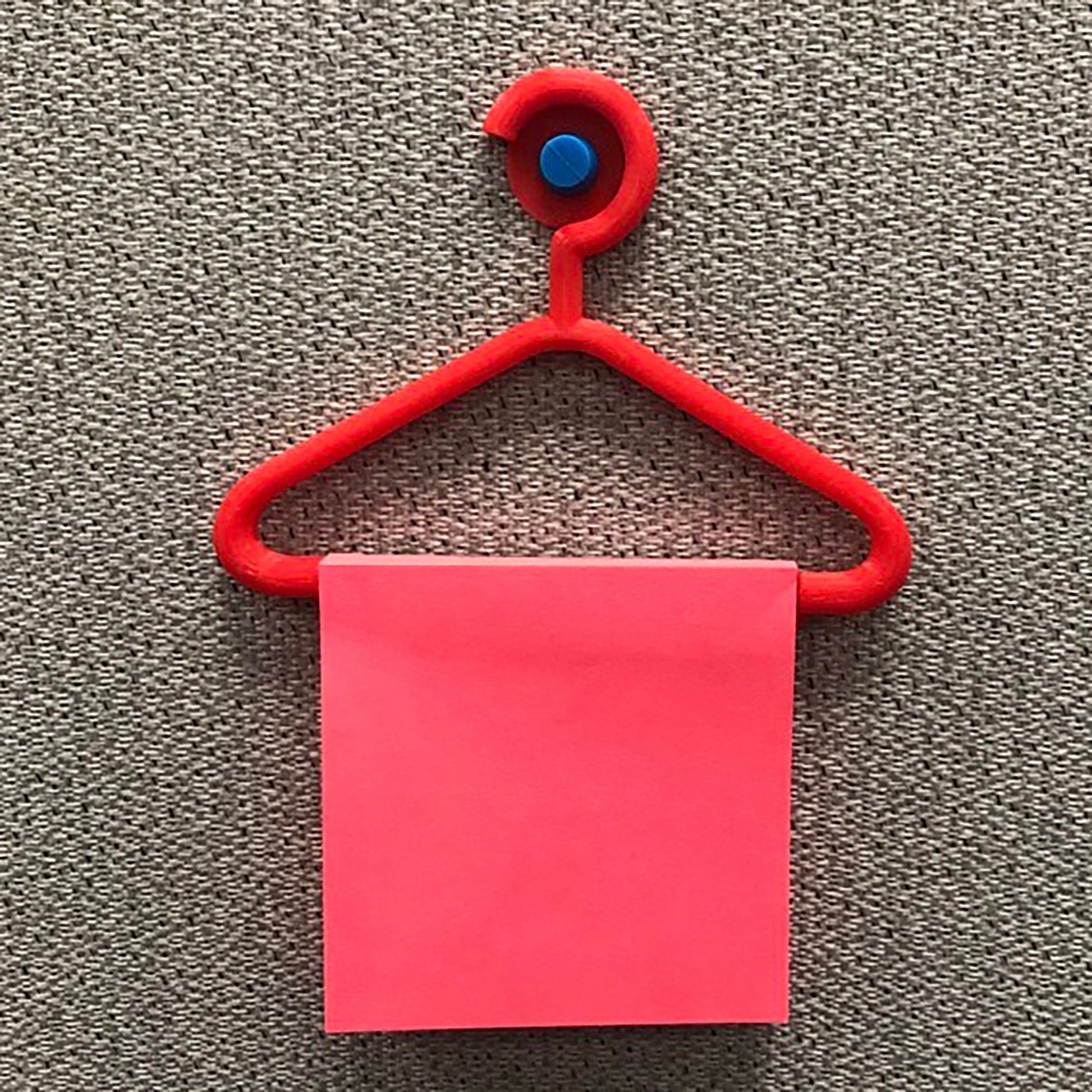 a red piece of paper hanging on a red hanger