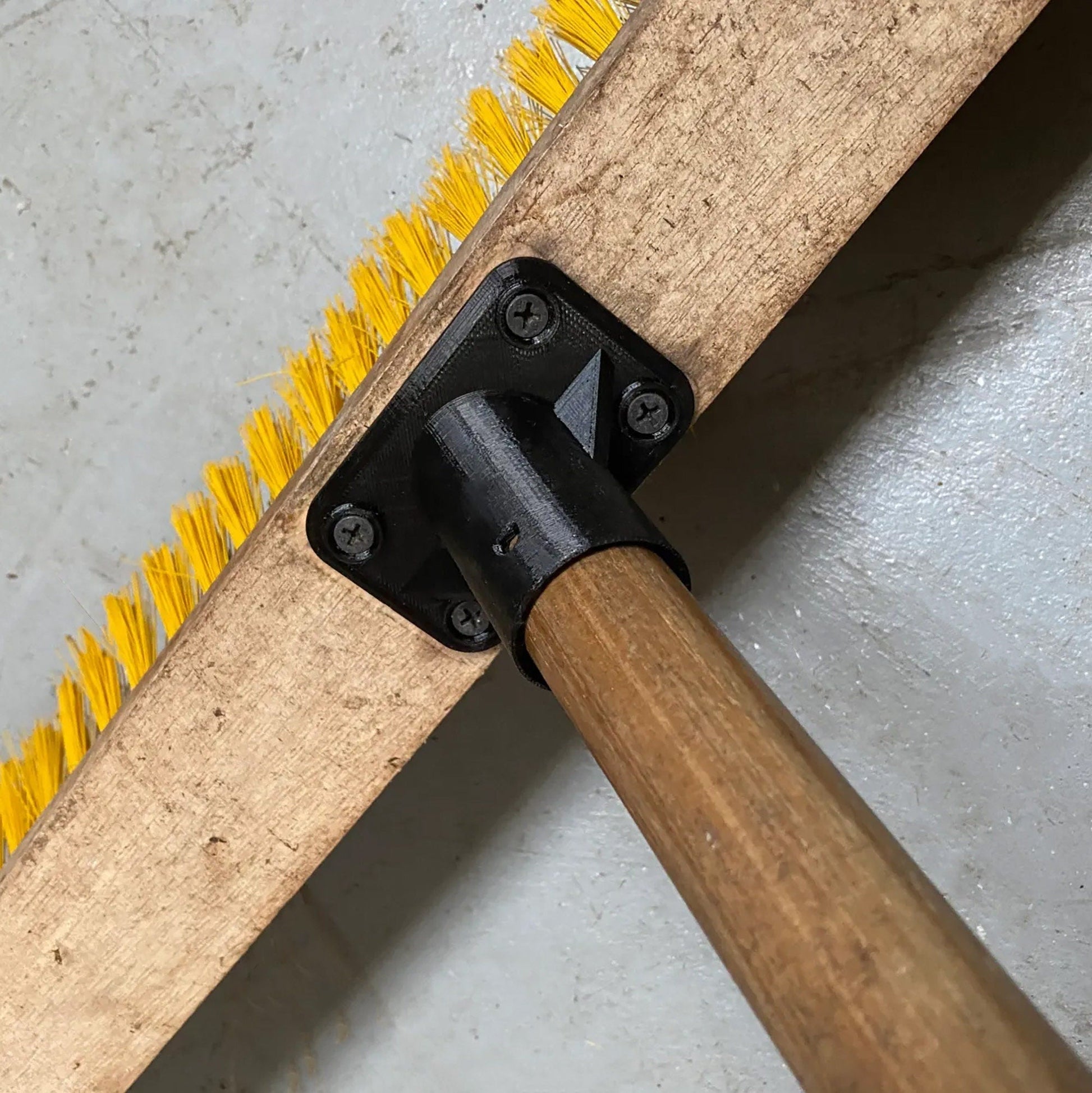 a close up of a brush with a wooden handle