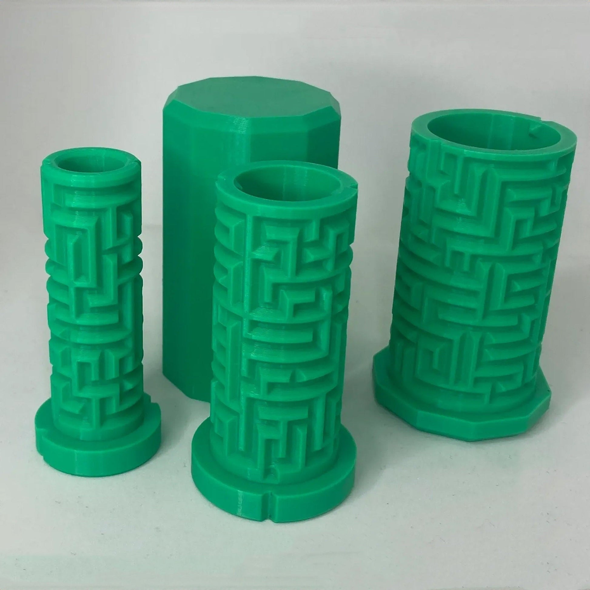 a group of green vases sitting next to each other