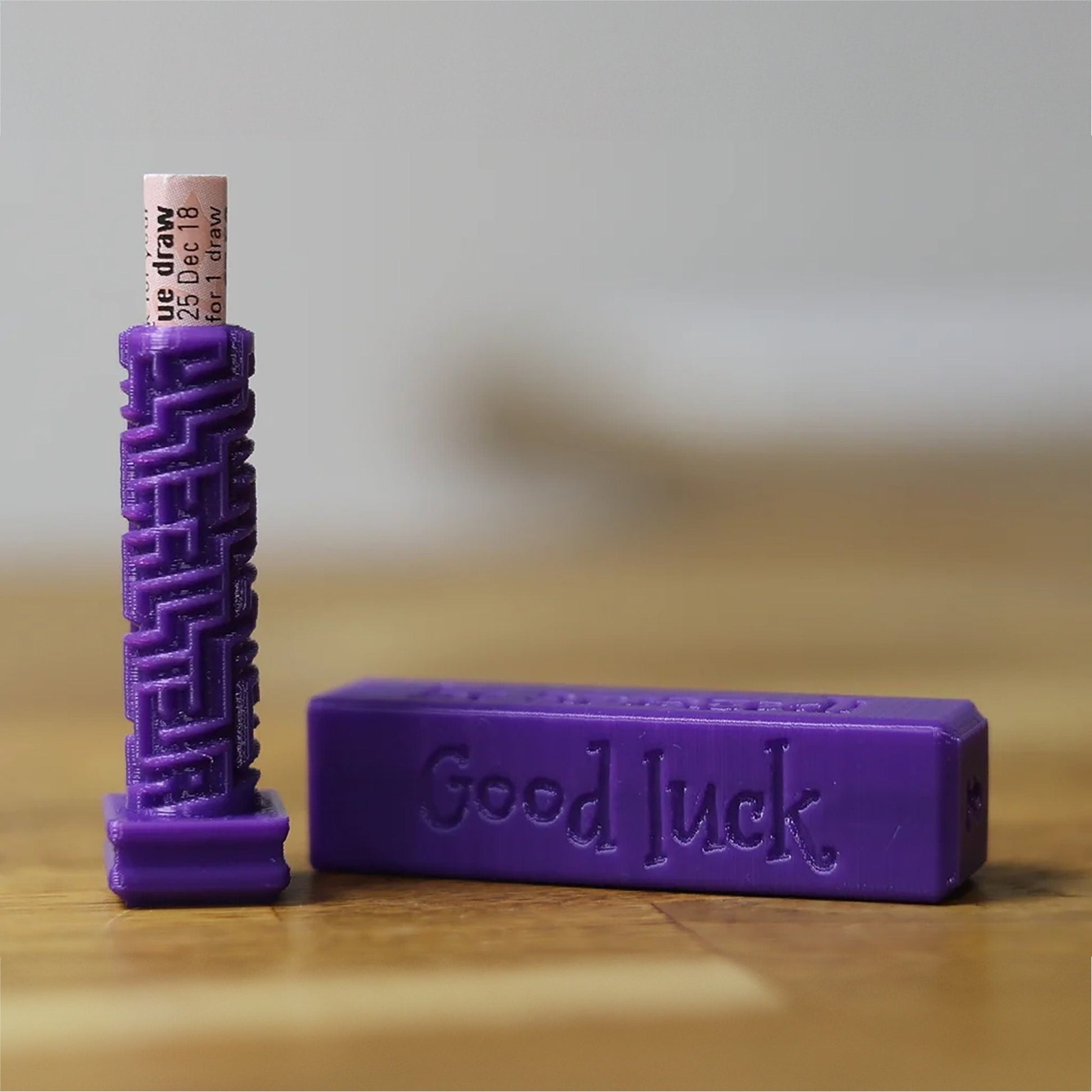 a purple bar of soap sitting on top of a wooden table