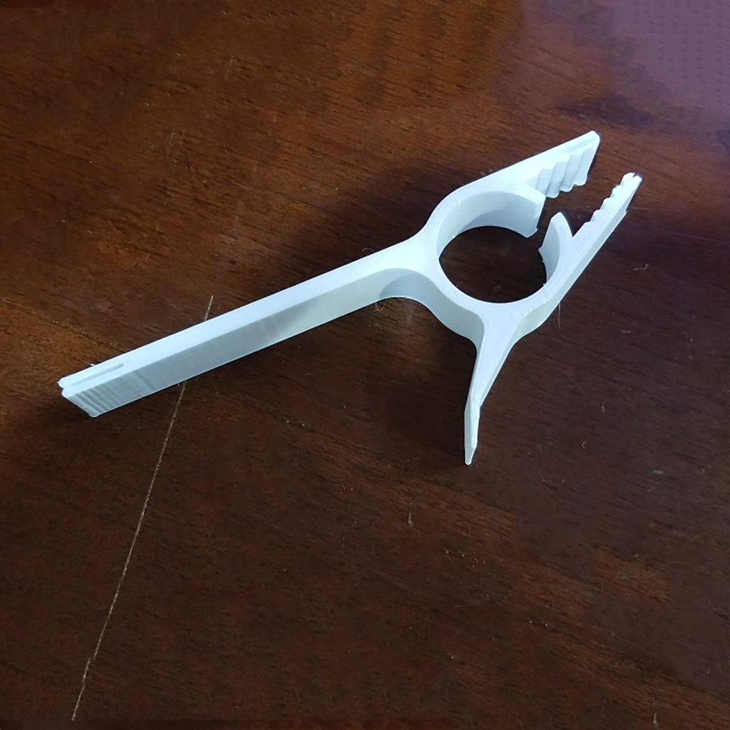 Under cabinet clip holding a recipe card at eye level
