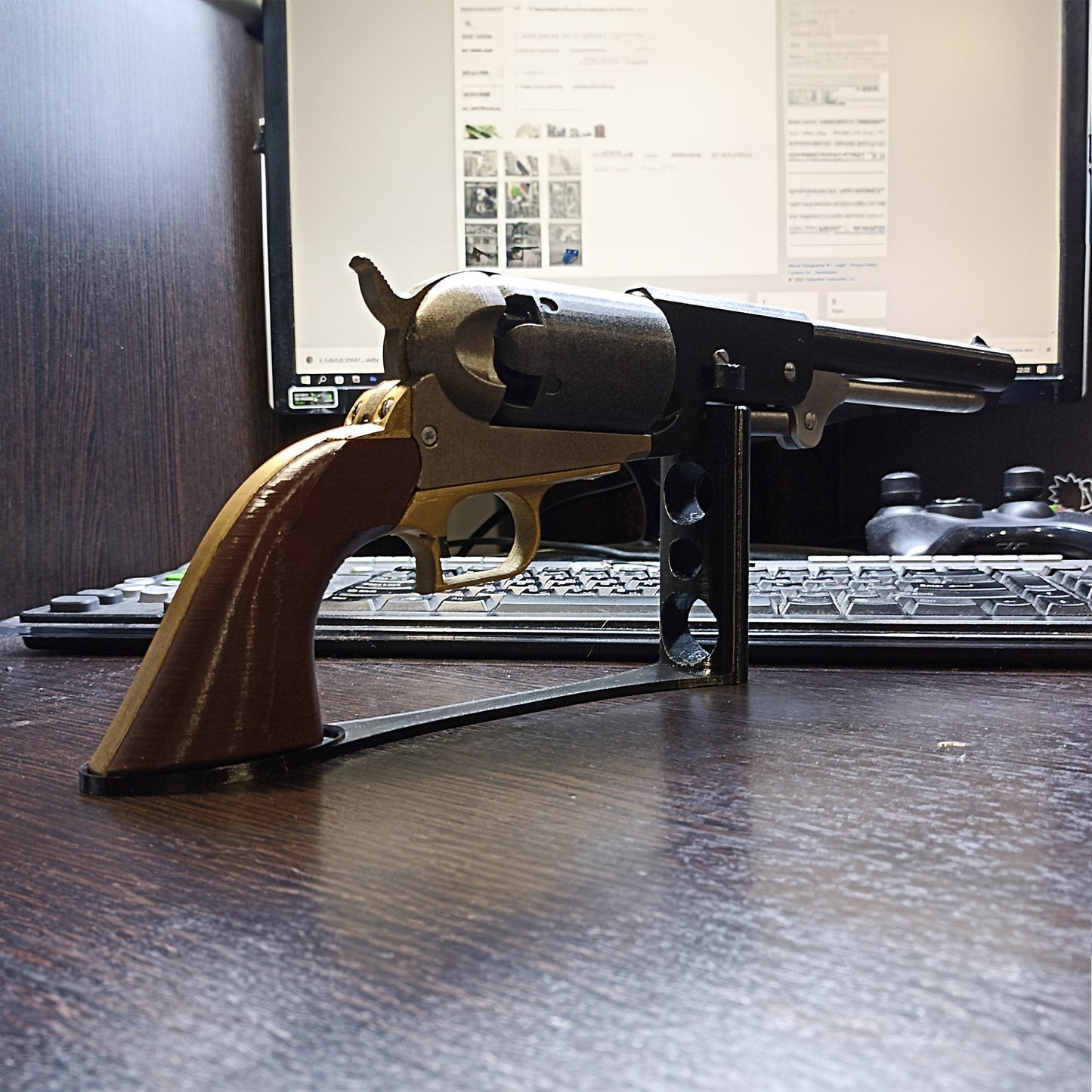 a toy gun sitting on top of a wooden desk