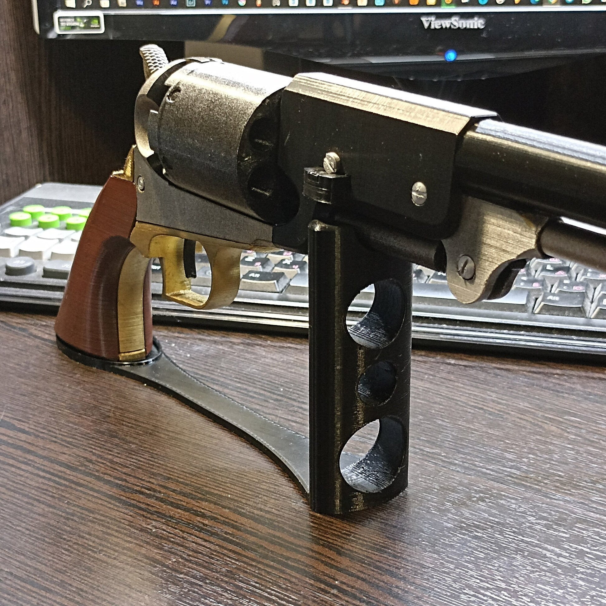 a toy gun sitting on top of a wooden table