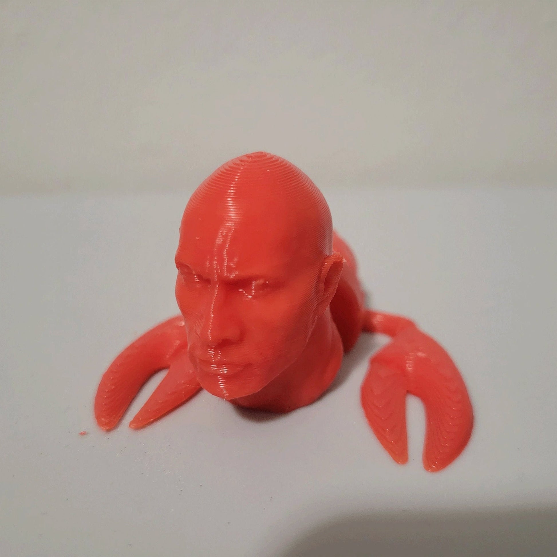 a close up of a plastic head on a table