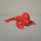 Articulated lobster fidget toy with flexible segmented tail and pivoting claws