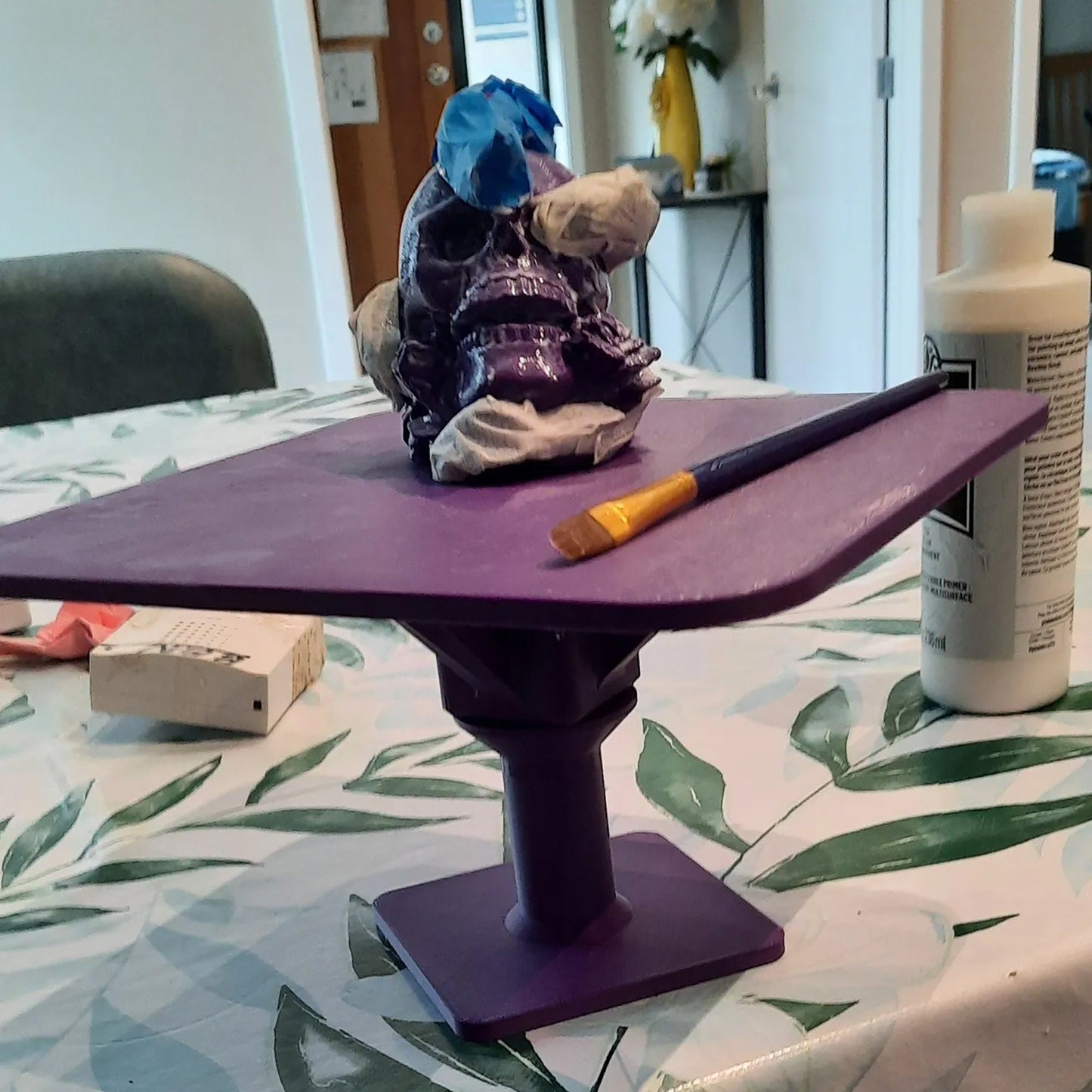 a close up of a table with a purple object on it