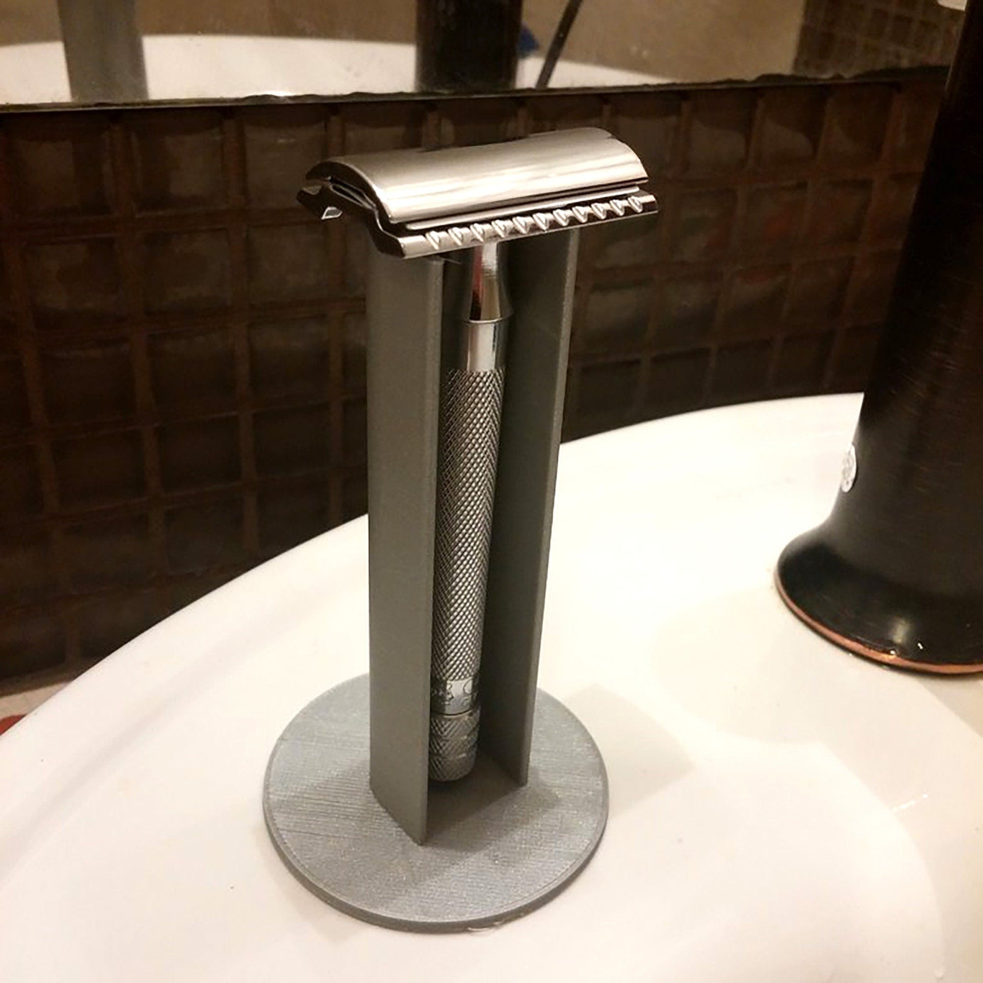 a close up of a metal object on a sink