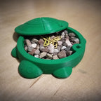 Turtle shaped desk organizer bin with a removable shell lid, view 2