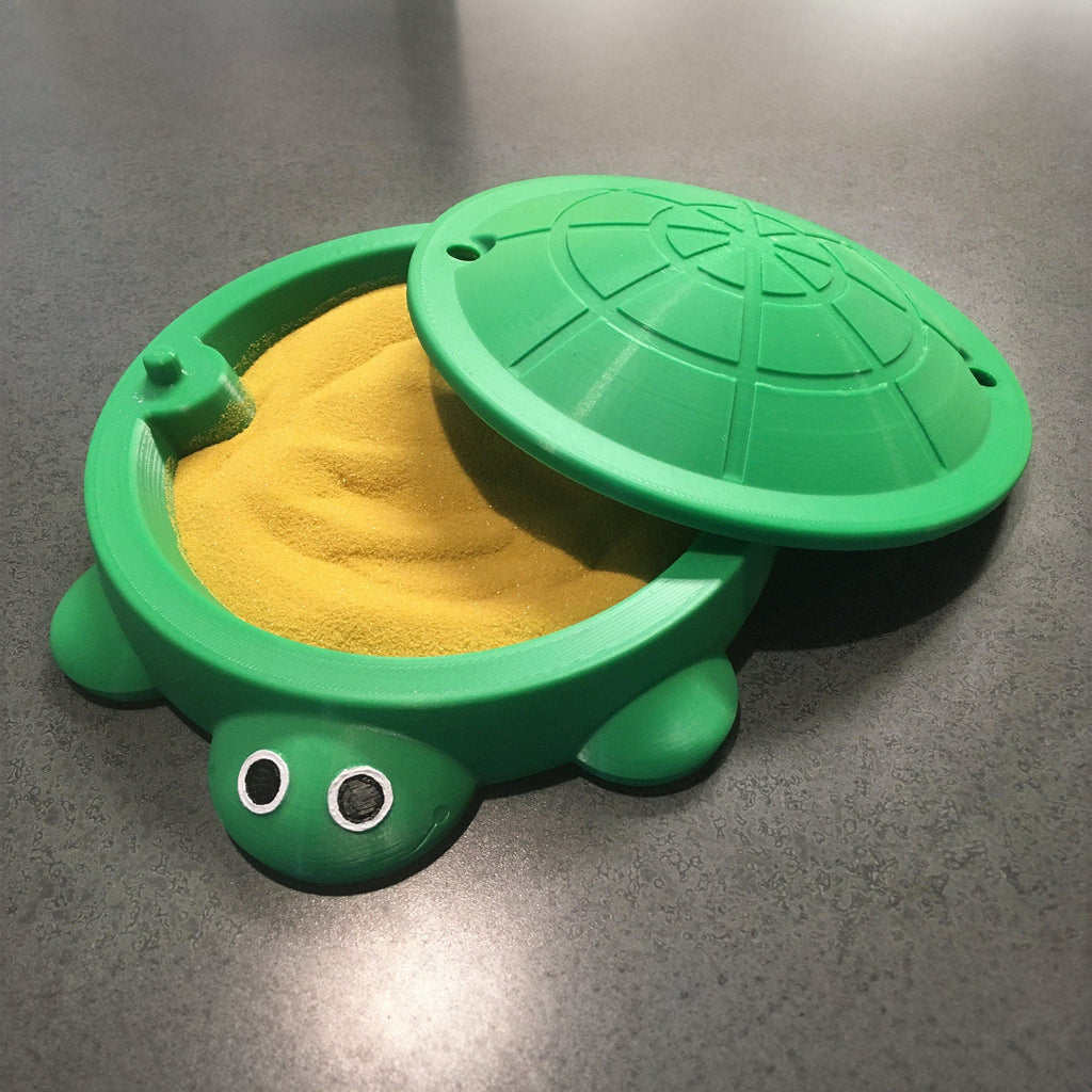 Turtle shaped desk organizer bin with a removable shell lid