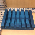 Self-draining slatted soap dish on the edge of a kitchen sink, view 2
