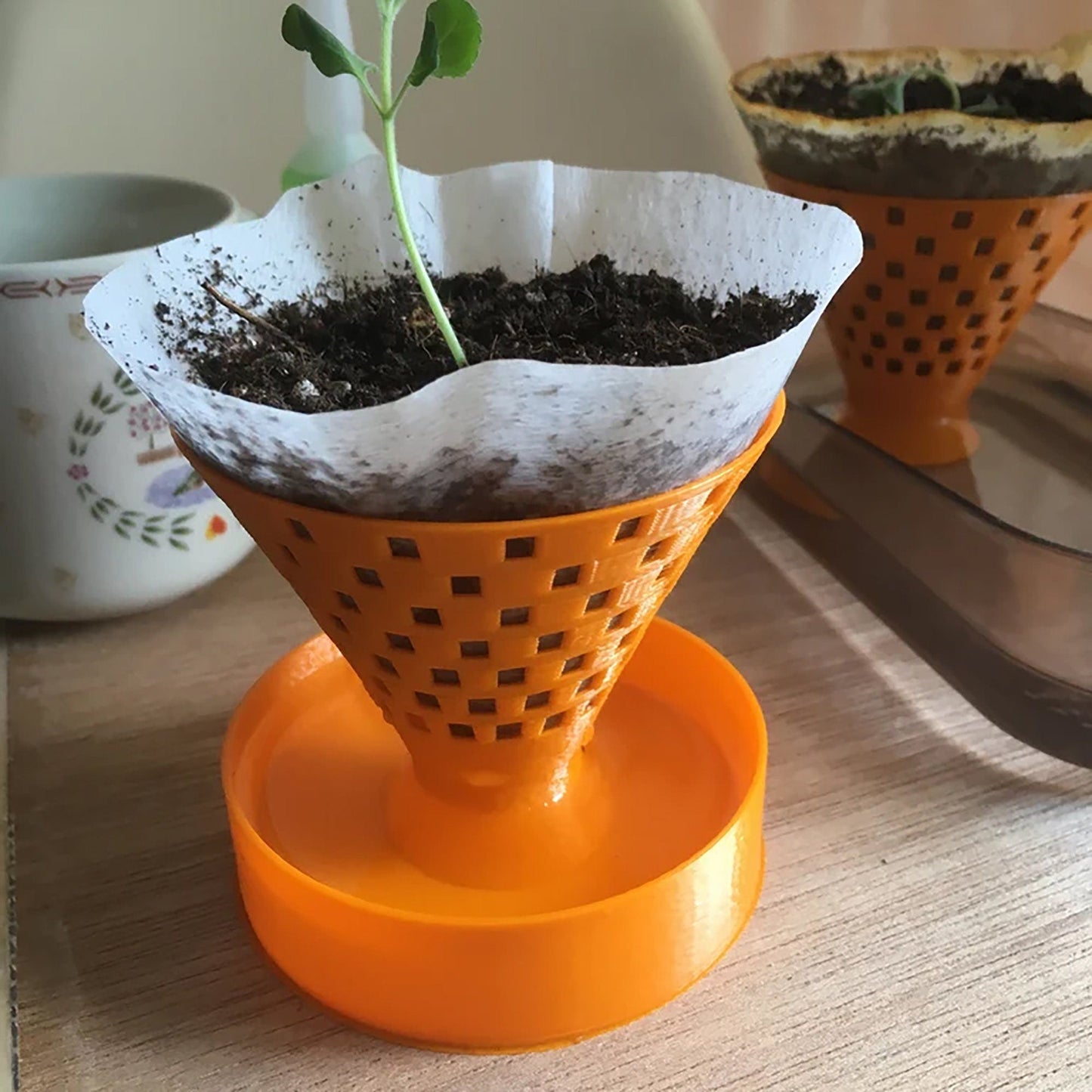 a potted plant sitting on top of an orange stand