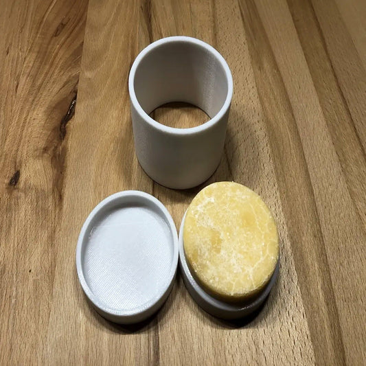 a couple of cups sitting on top of a wooden table