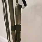 Wand clip holding two attachments on a Shark Rocket stick vacuum, view 2