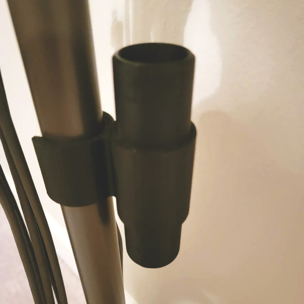 Wand clip holding two attachments on a Shark Rocket stick vacuum