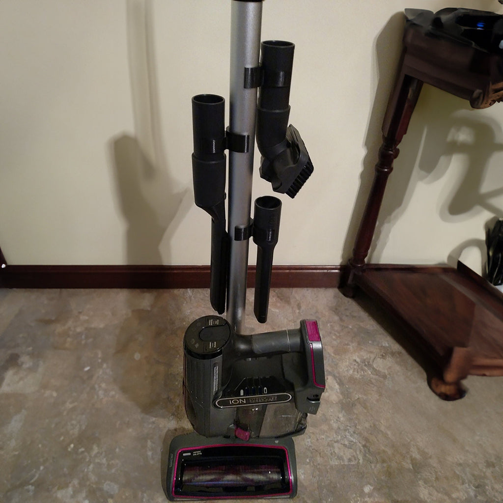 Three tool retainer clips holding attachments on a Shark Rocket vacuum wand