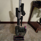 Three tool retainer clips holding attachments on a Shark Rocket vacuum wand