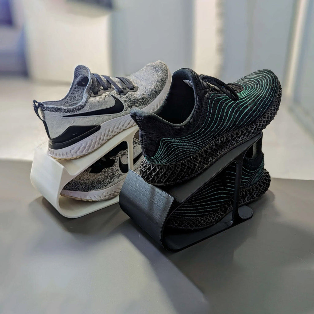 Angled sneaker storage rack stacking a pair of shoes one above the other, view 3