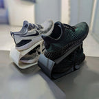 Angled sneaker storage rack stacking a pair of shoes one above the other, view 3