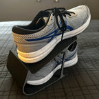 Angled sneaker storage rack stacking a pair of shoes one above the other, view 4