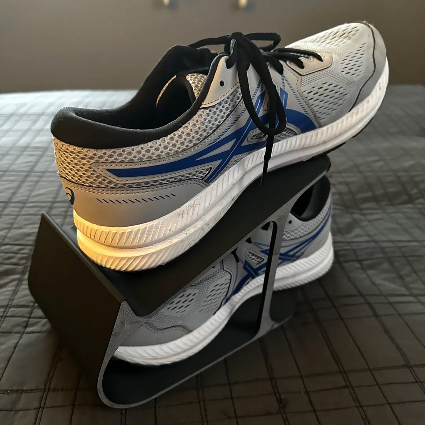 a pair of white and blue running shoes