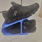 Angled sneaker storage rack stacking a pair of shoes one above the other