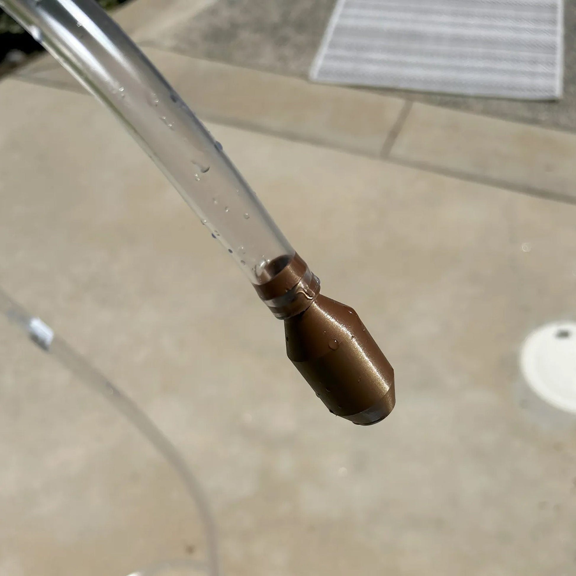 a water spigot with a brown spigot attached to it