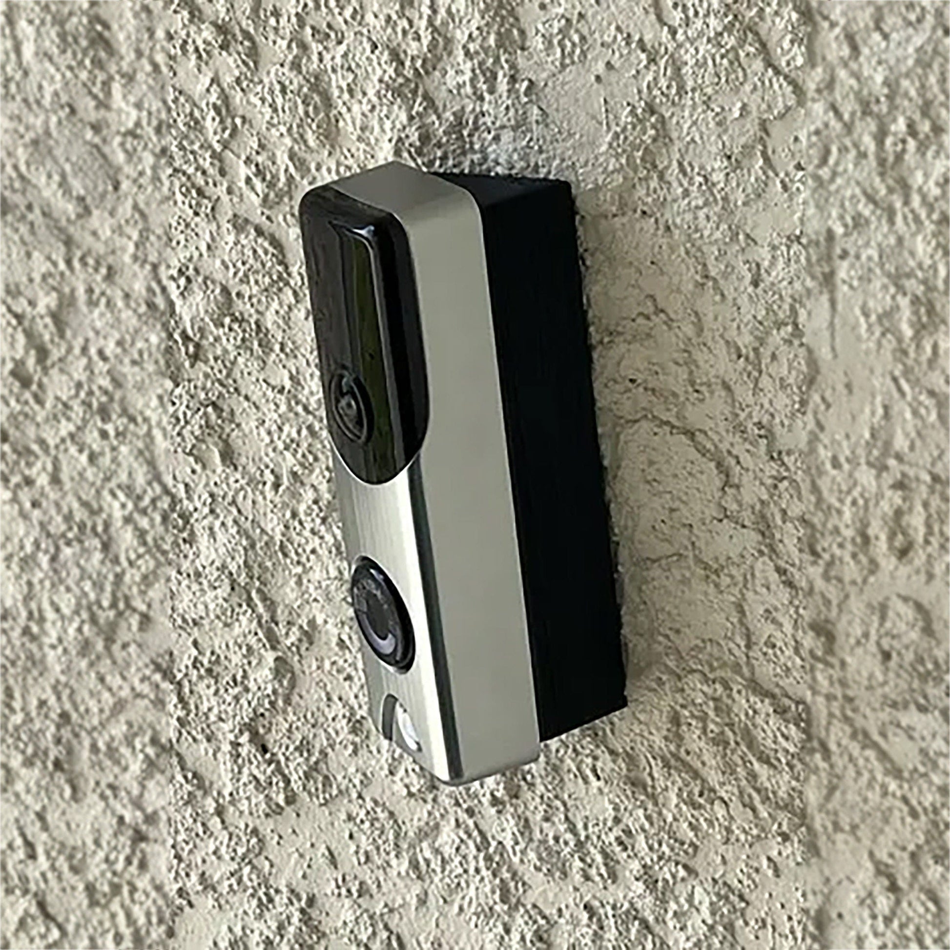 a cell phone is laying on the wall