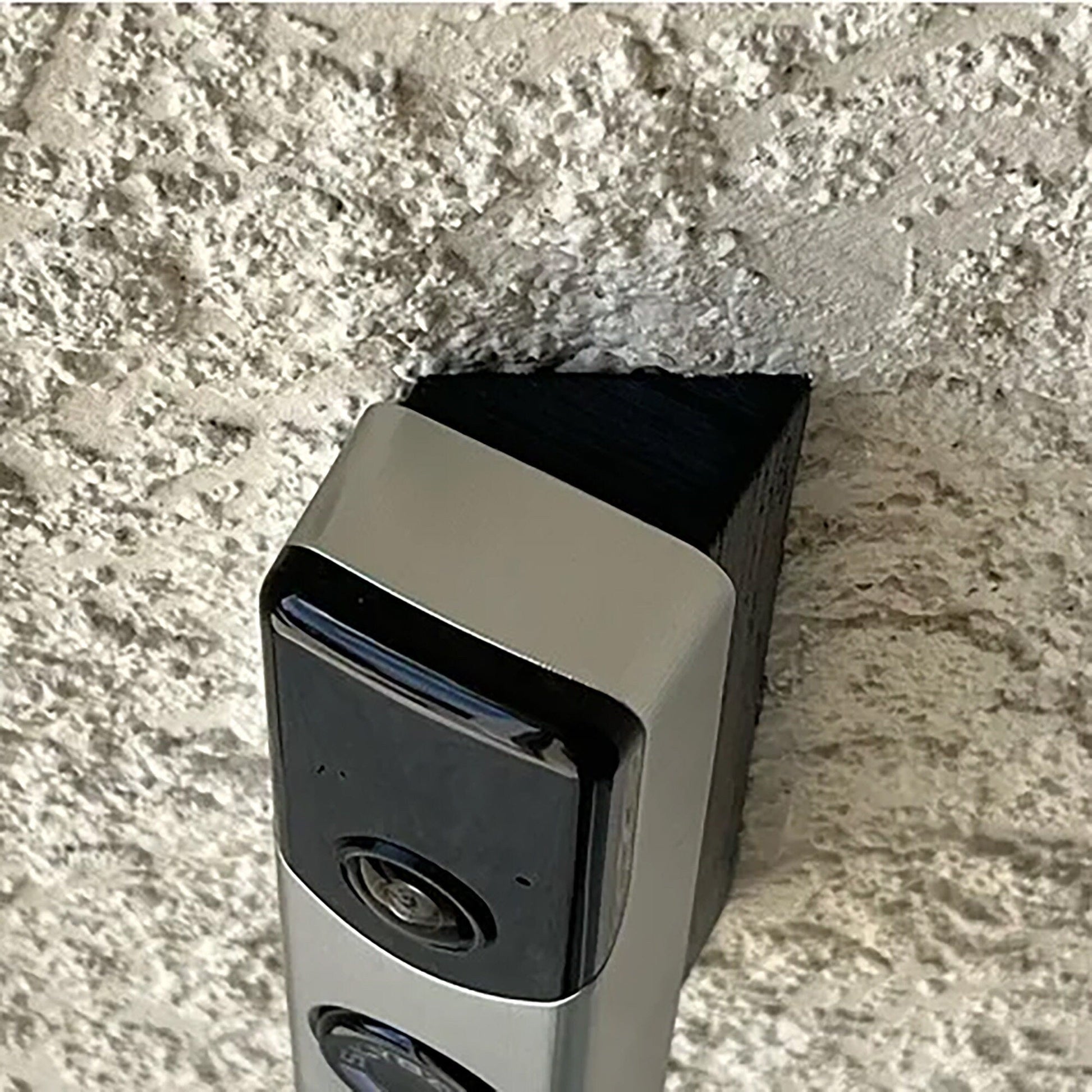 a silver and black device on a wall