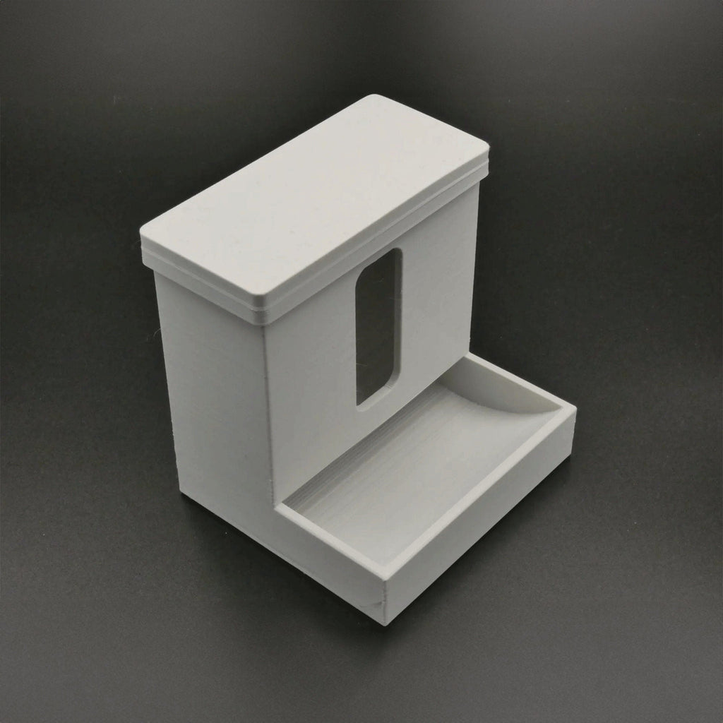 Covered cotton swab dispenser with a front catch tray on a bathroom vanity, view 3