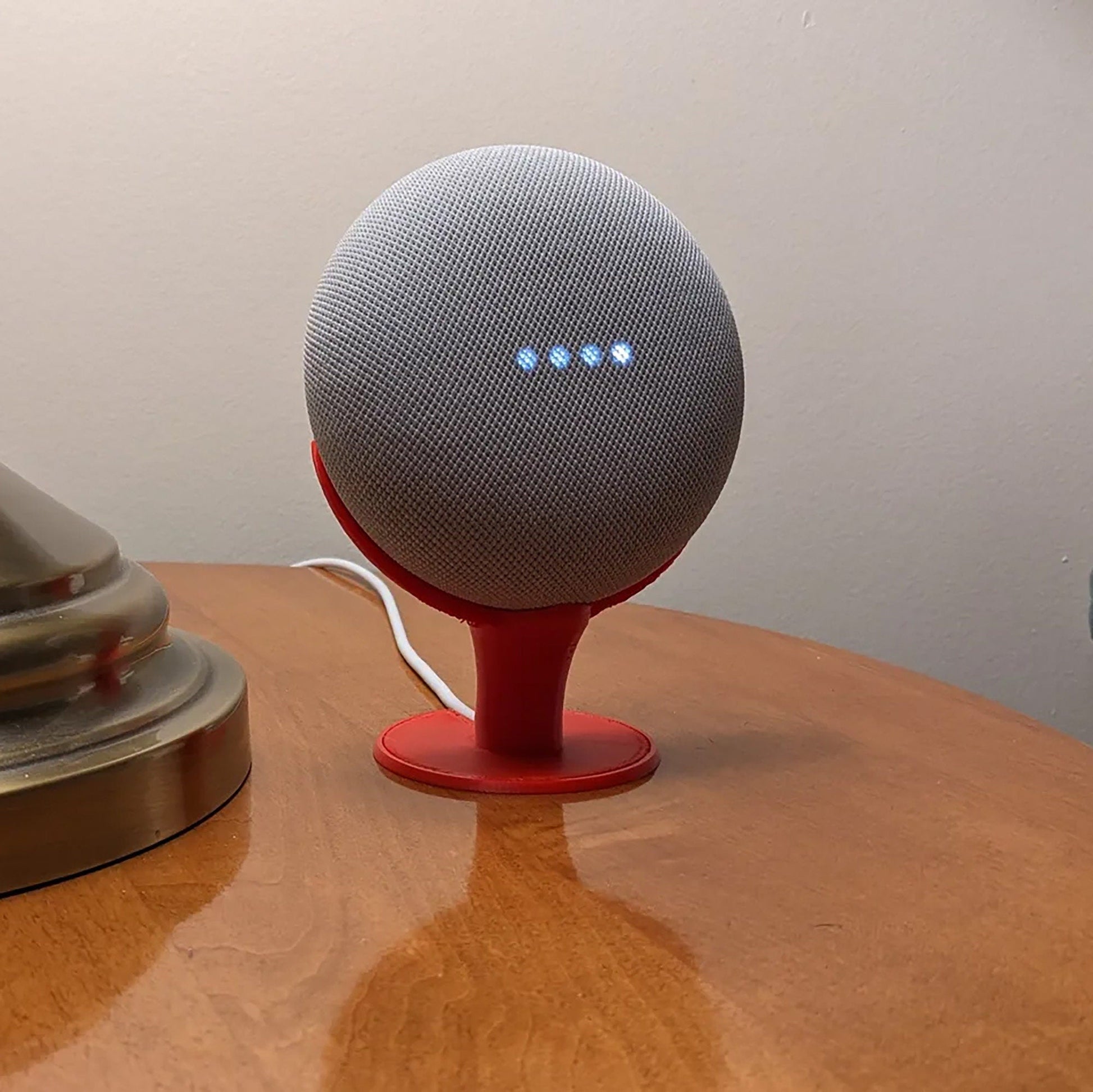 a speaker sitting on top of a wooden table