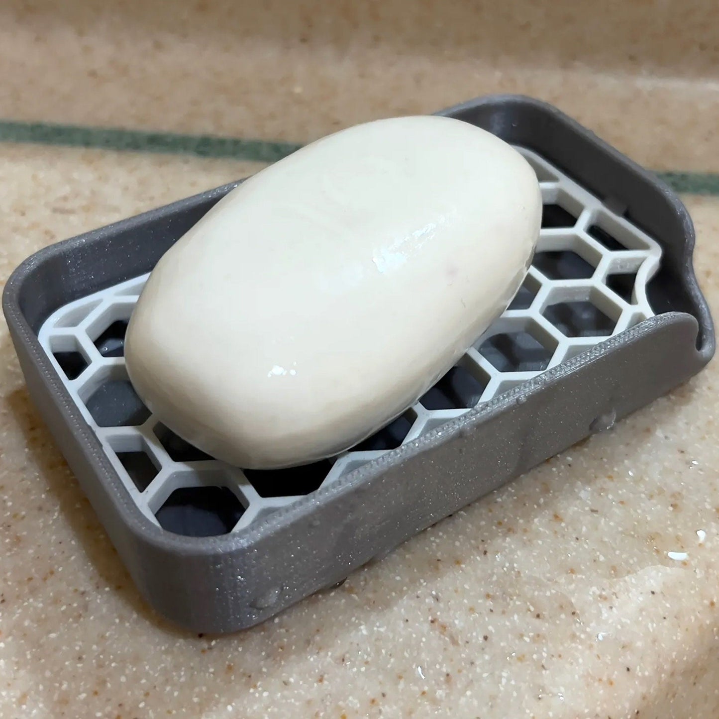 a close up of a soap dish on a counter