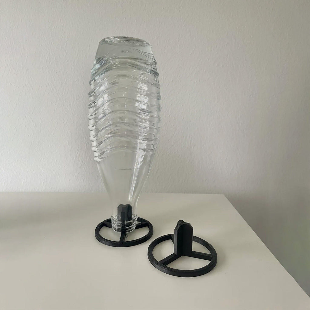 Three drying stands holding SodaStream bottles upside down to drain, view 3