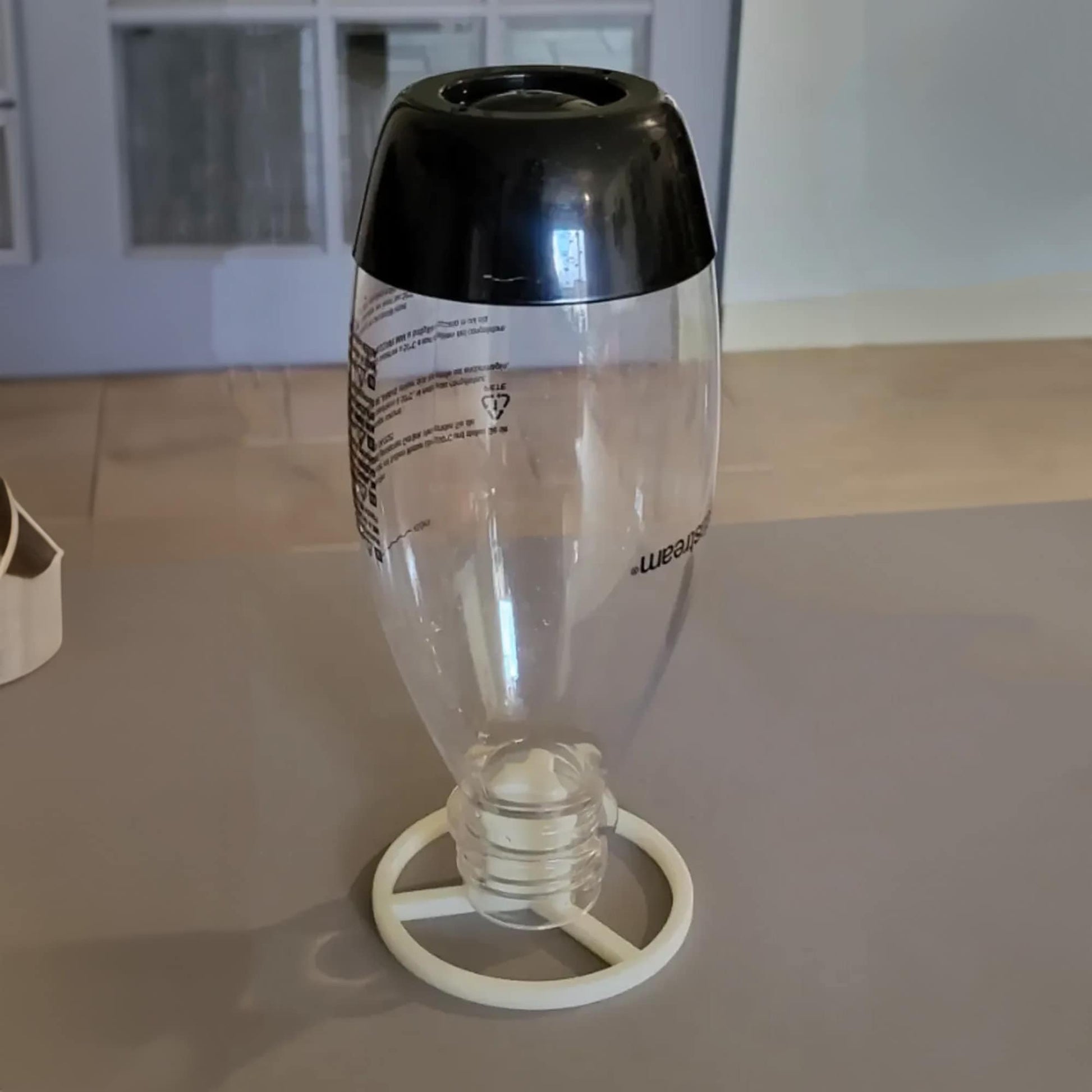 a black and white vase sitting on top of a table