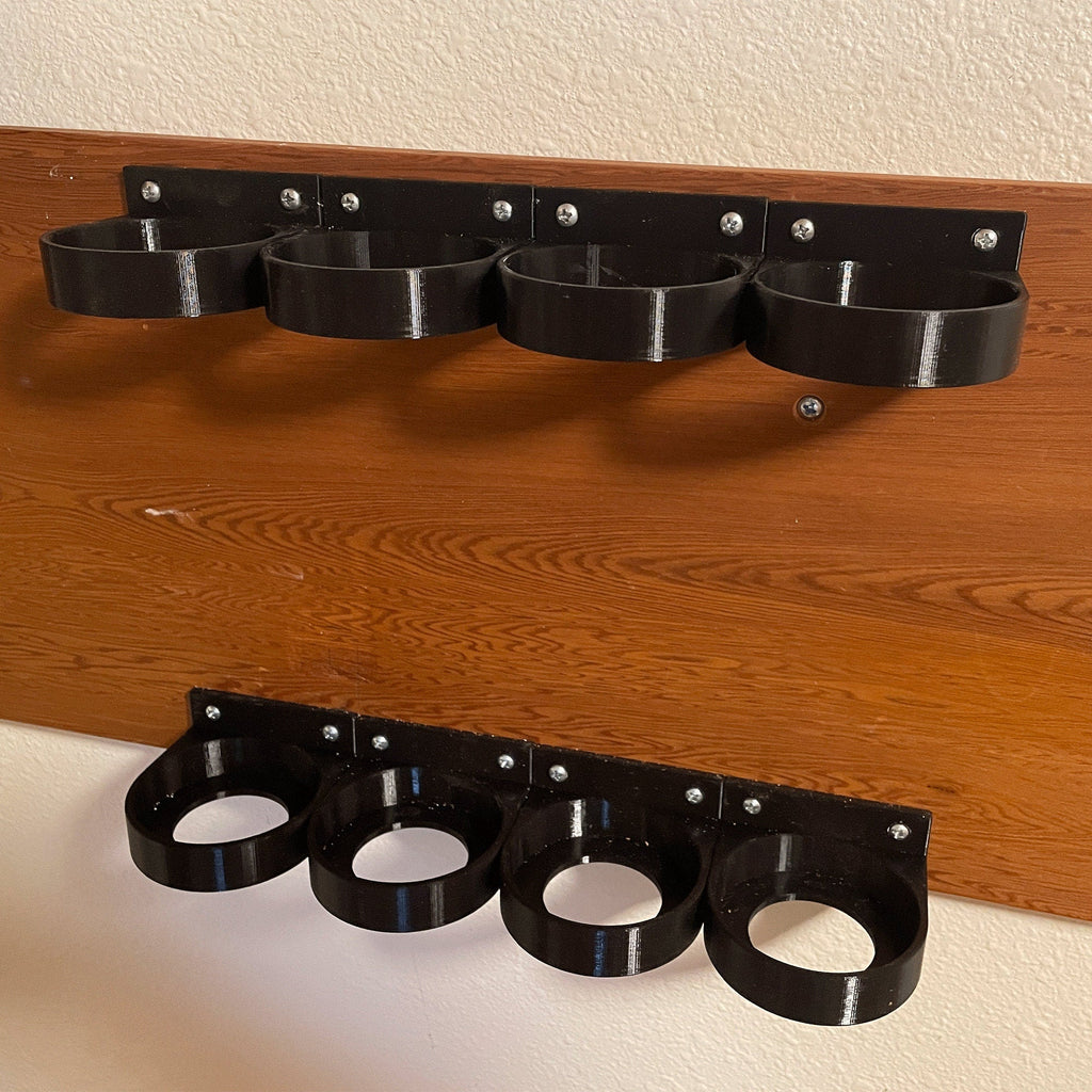 Wall mount rack holding spare SodaStream 60L CO2 cylinders under a cabinet, view 2