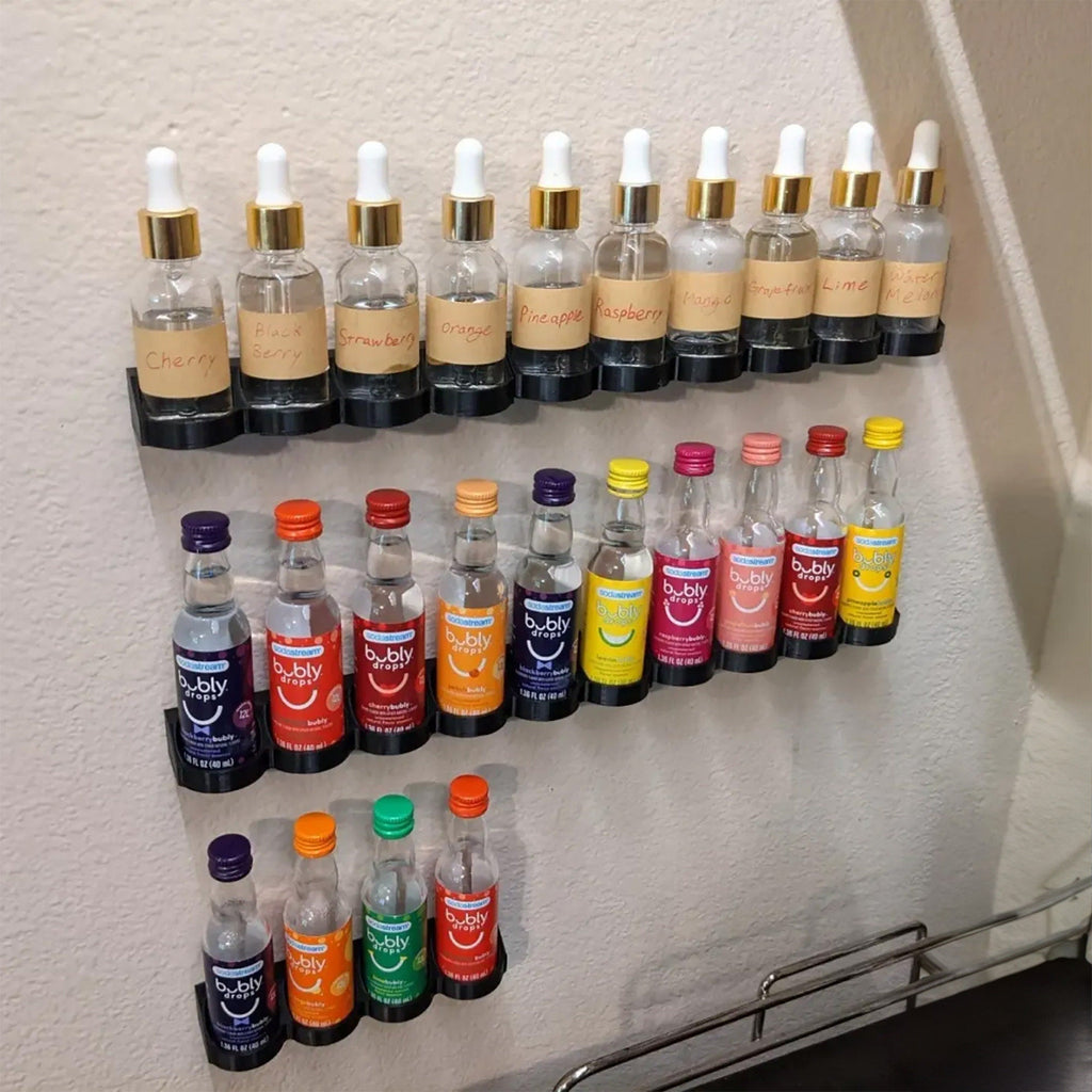 Wall rack holding 40ml SodaStream flavor bottles in a row