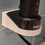 Wall mount holder for a Sonicare HX6100 charger with toothbrush docked, view 3