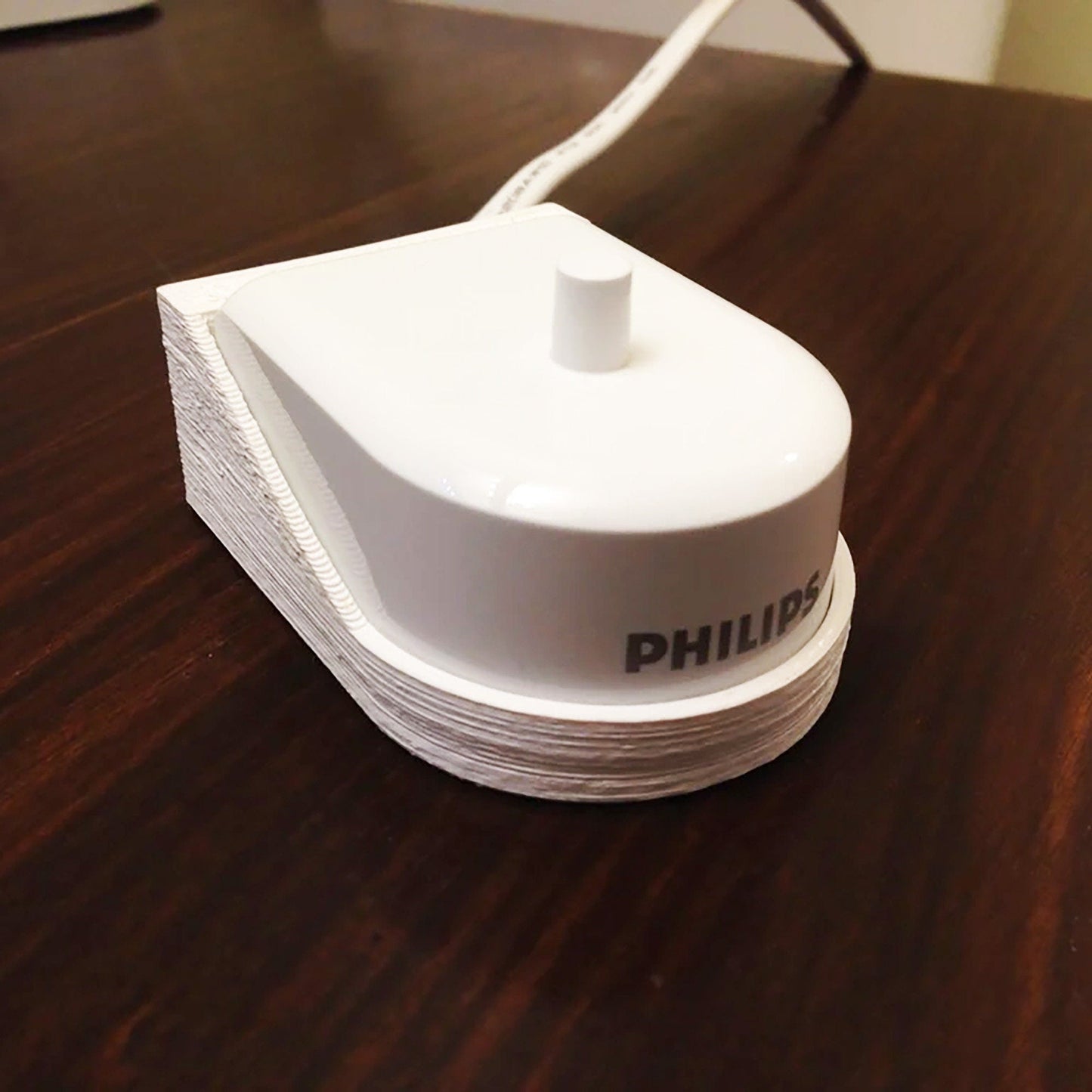 a white object sitting on top of a wooden table