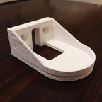 Wall mount holder for a Sonicare HX6100 charger with toothbrush docked, view 5