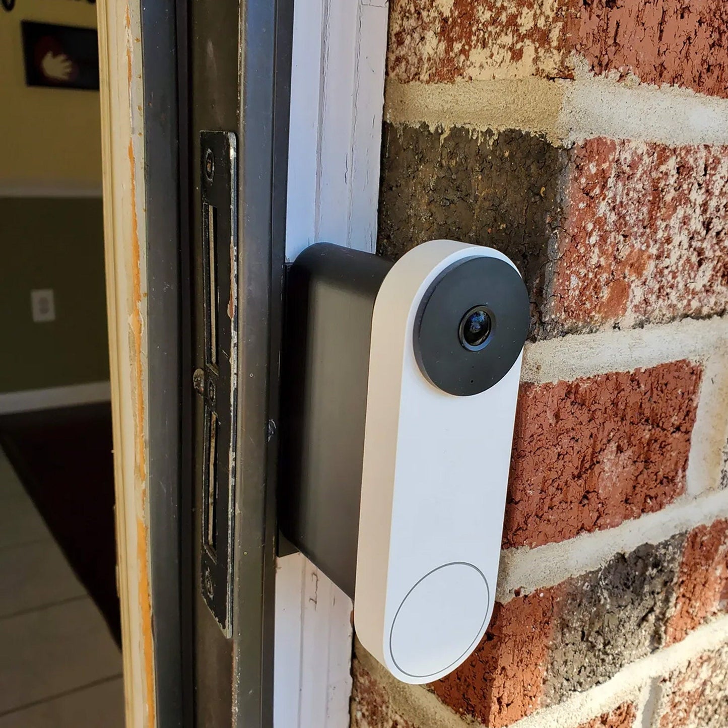 a security camera mounted on a brick wall