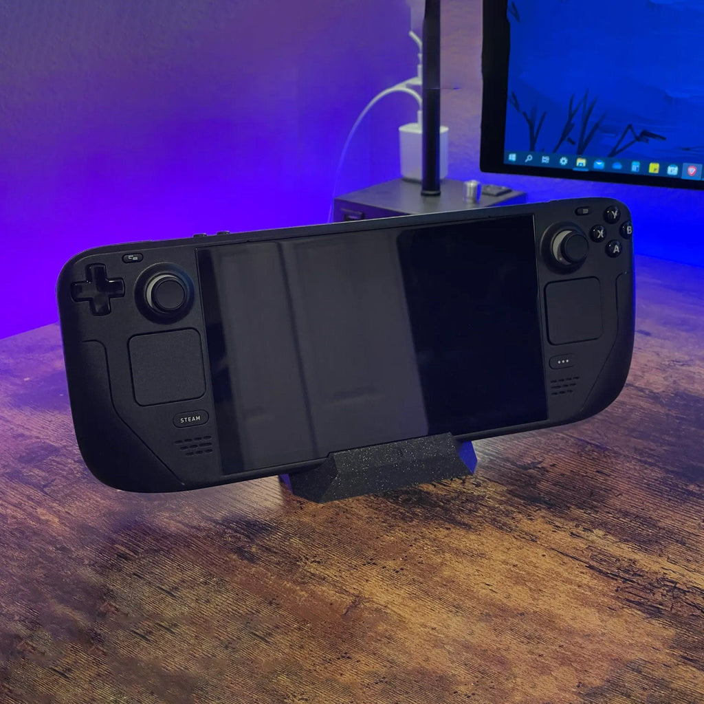 Low desk stand holding a Steam Deck handheld console upright at an angle