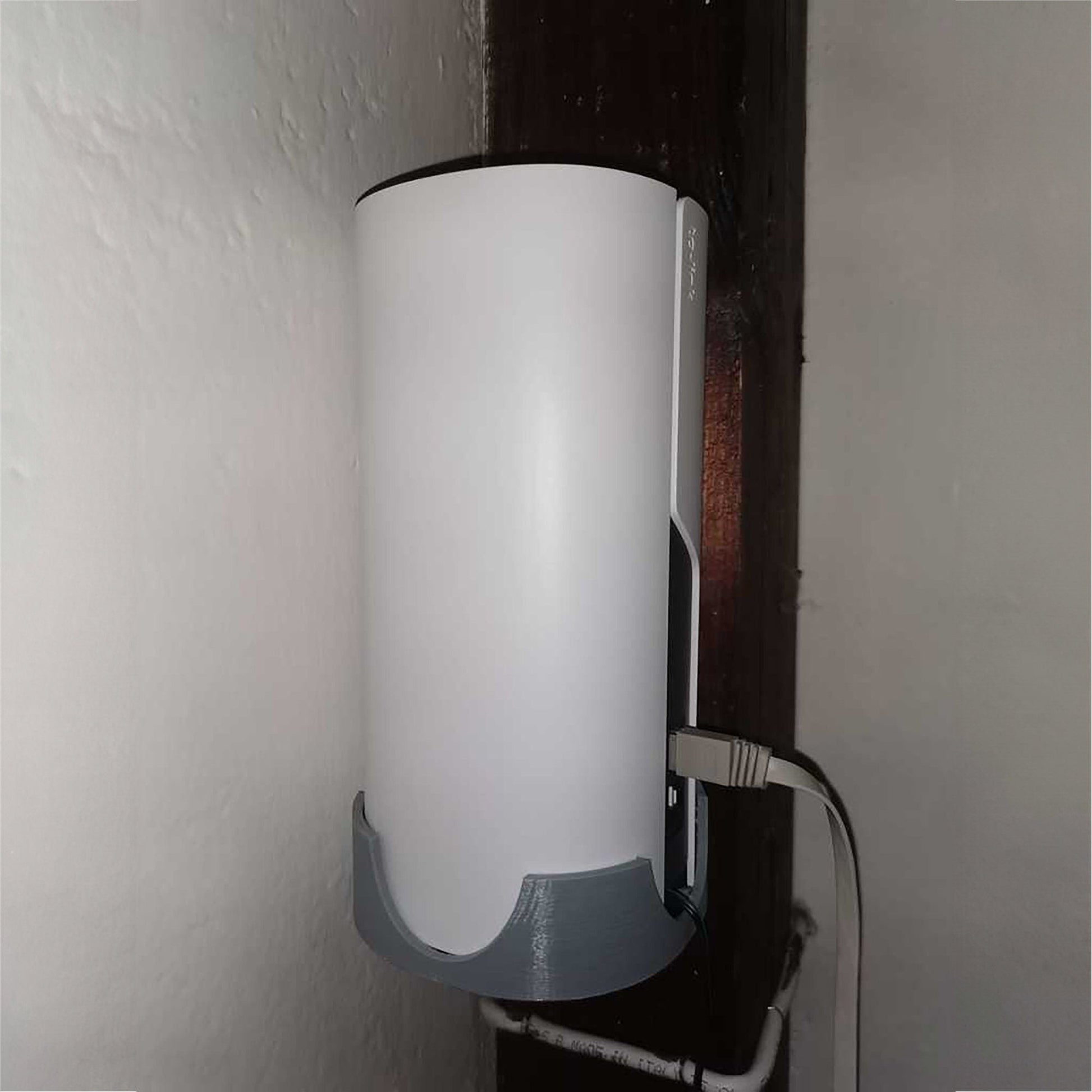 a wall mounted light fixture in a bathroom