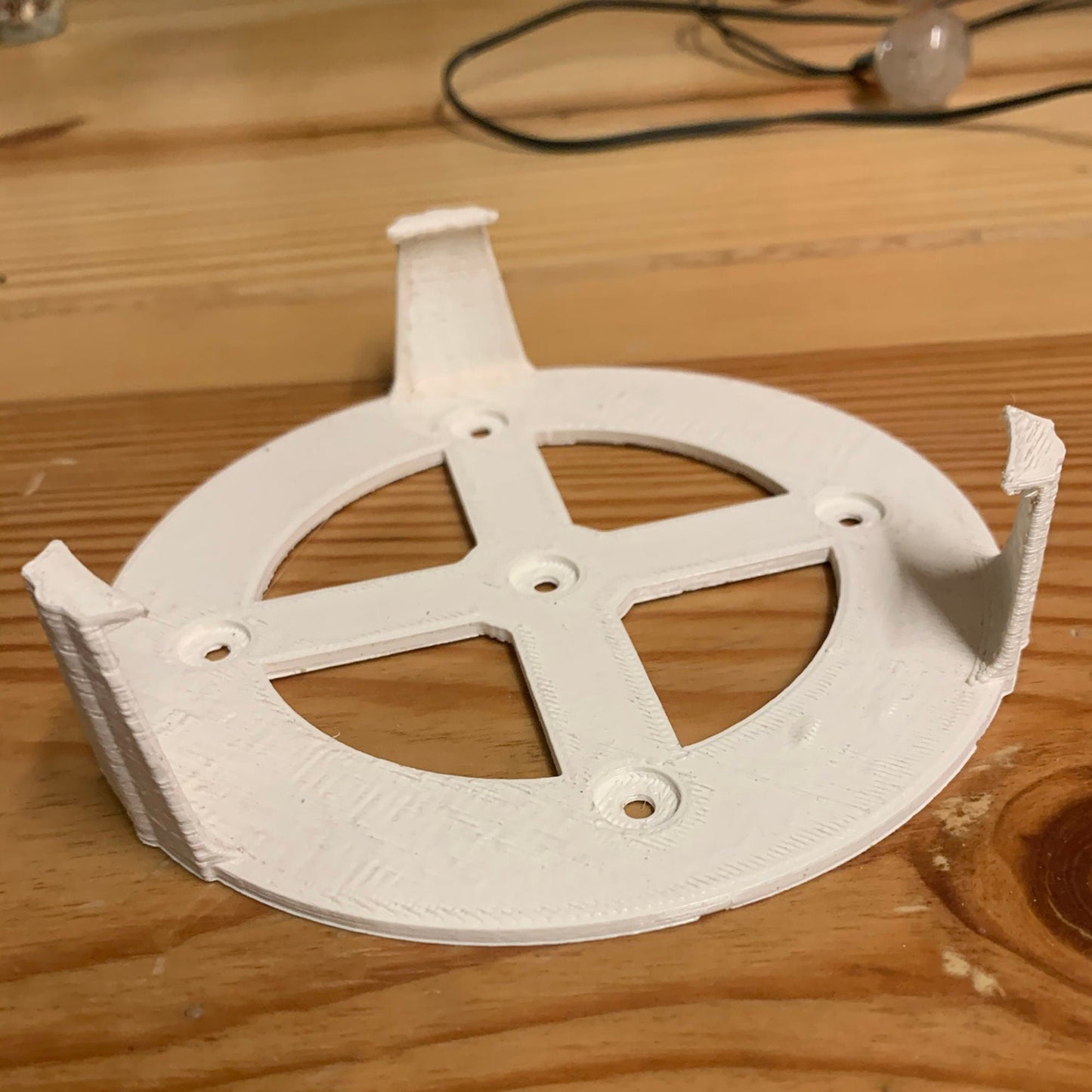 a white object sitting on top of a wooden table