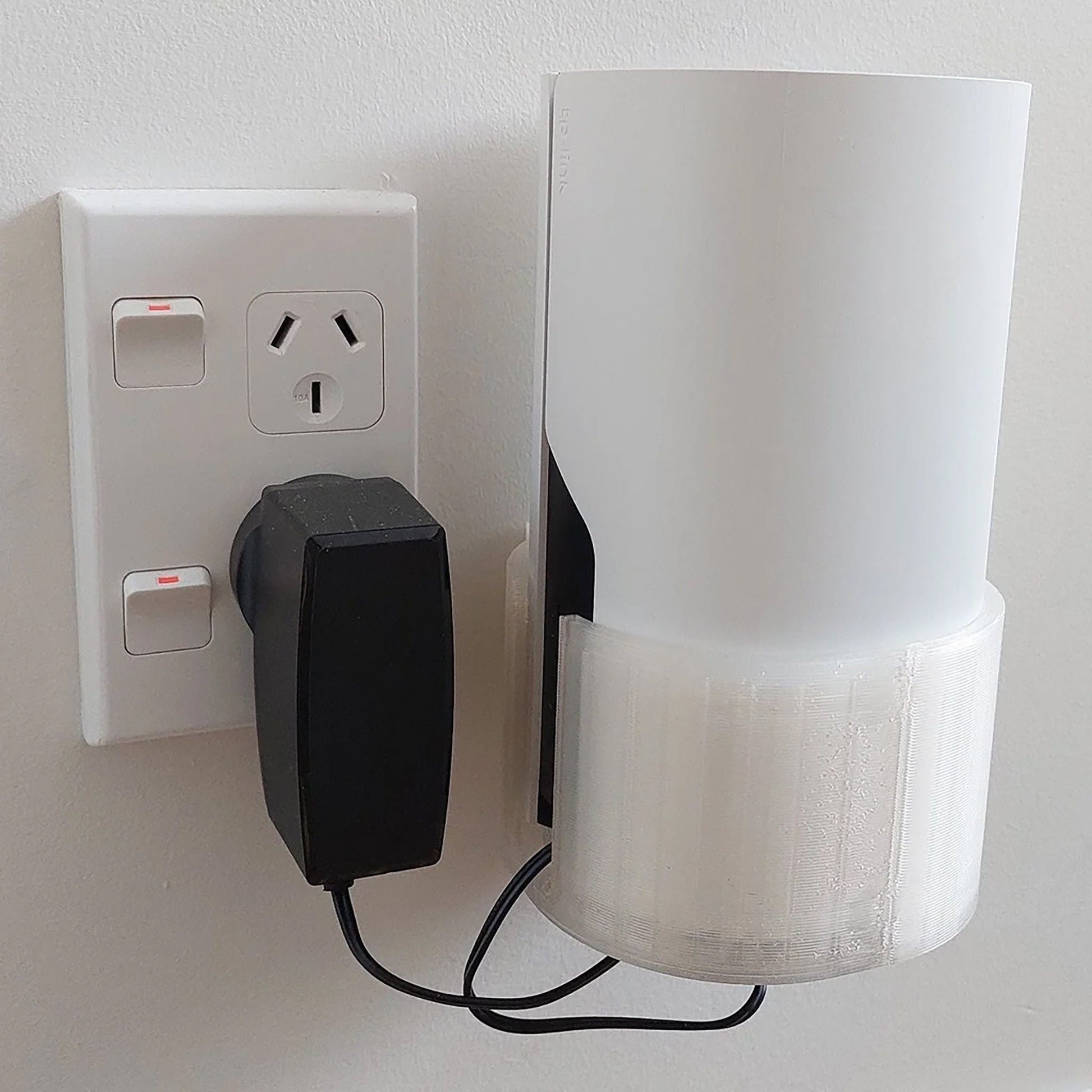 a white light switch and a black and white light